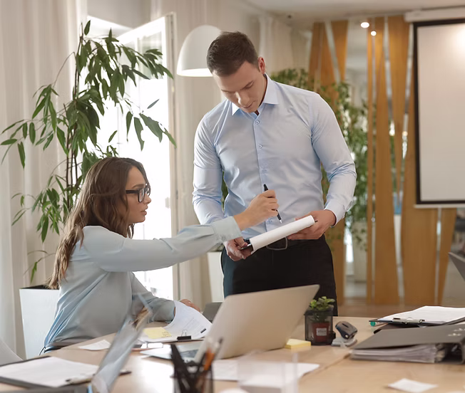 Two colleagues collaborating in an office